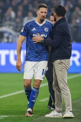 2 Bundesliga FC Schalke 04 SV Darmstadt 98 on 24 10 2025 at the Veltins Arena in Schalke Coach Miron Muslic Schalke hugs Janik Bachmann Schalke 14 during their substitution MH