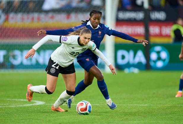 Jule Brand of Germany compete for the ball, tackling, duel, header, zweikampf, action, fight against Oriane Jean-Francois of France in the Women s Nations League 2025 Semi-Final first leg match GERMANY - FRANCE 1-0 on October 24, 2025 in Düsseldorf, Germany. Season 2025 2026