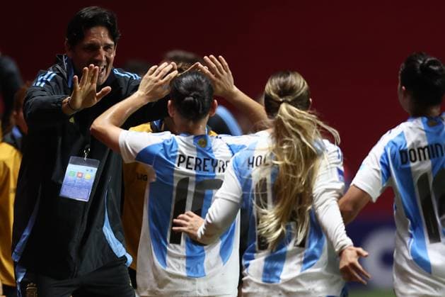Argentina s midfielder Maricel Pereyra C celebrates with head coach German Portanova L and teammates after scoring the team™s third goal during the CONMEBOL Women s Nations League football match, qualifier for the 2027 World Cup in Brazil, between Argentina and Paraguay, at the Diego Armando Maradona stadium in Buenos Aires, Argentina on October 24, 2025 BUENOS AIRES ARGENTINA Copyright: xALEJANDROxPAGNIx