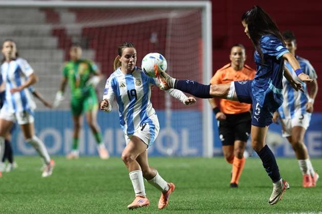 Paraguay s defender Dahiana Bogarin R vies for the ball with Argentina s midfielder Agostina Holzheier during the CONMEBOL Women s Nations League football match, qualifier for the 2027 World Cup in Brazil, between Argentina and Paraguay, at the Diego Armando Maradona stadium in Buenos Aires, Argentina on October 24, 2025 BUENOS AIRES ARGENTINA Copyright: xALEJANDROxPAGNIx