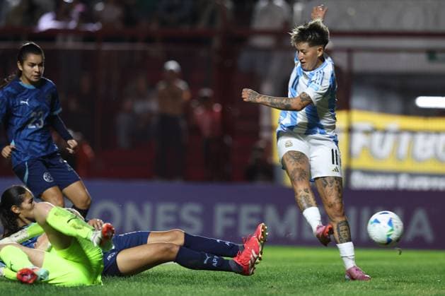 Argentina s forward Yamila Rodriguez R shoots next Paraguay s goalkeeper Cristina Recalde bottom L during the CONMEBOL Women s Nations League football match, qualifier for the 2027 World Cup in Brazil, between Argentina and Paraguay, at the Diego Armando Maradona stadium in Buenos Aires, Argentina on October 24, 2025 BUENOS AIRES ARGENTINA Copyright: xALEJANDROxPAGNIx