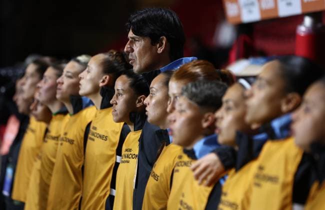 Argentina s head coach German Portanova C and players sing the national anthem before the CONMEBOL Women s Nations League football match, qualifier for the 2027 World Cup in Brazil, between Argentina and Paraguay, at the Diego Armando Maradona stadium in Buenos Aires, Argentina on October 24, 2025 BUENOS AIRES ARGENTINA Copyright: xALEJANDROxPAGNIx