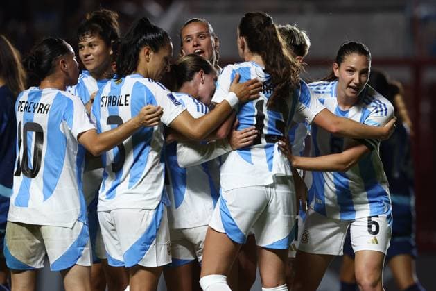 Argentina s defender Aldana Cometti R celebrates with teammates after scoring the team™s first goal during the CONMEBOL Women s Nations League football match, qualifier for the 2027 World Cup in Brazil, between Argentina and Paraguay, at the Diego Armando Maradona stadium in Buenos Aires, Argentina on October 24, 2025 BUENOS AIRES ARGENTINA Copyright: xALEJANDROxPAGNIx