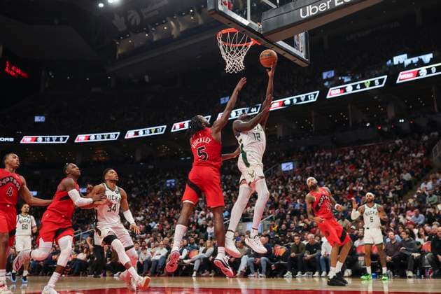 October 24, 2025, Toronto, On, Canada: Milwaukee Bucks Taurean Prince (12) goes to the basket past Toronto Raptors Immanuel Quickley (5) during second half NBA, Basketball Herren, USA basketball action in Toronto on Friday, October 24, 2025. Canada News - October 24, 2025  - ZUMAc35_ 20251024_zaf_c35_147 Copyright: xNickxIwanyshynx
