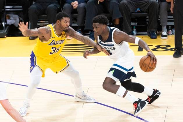 October 24, 2025, Los Angeles, California, USA: Minnesota Timberwolves Anthony Edwards (5) drives against Los Angeles LakersÃ¢â‚¬â ¢ Marcus Smart (36) during an NBA, Basketball Herren, USA basketball game, in Los Angeles Friday, Oct. 24, 2025. Los Angeles USA - ZUMAc68_ 20251024_zaf_c68_041 Copyright: xRingoxChiux