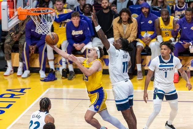 October 24, 2025, Los Angeles, California, USA: Los Angeles LakersÃ¢â‚¬â ¢ Austin Reaves (15) goes past Minnesota Timberwolves Naz Reid (11) to the basket during an NBA, Basketball Herren, USA basketball game, in Los Angeles Friday, Oct. 24, 2025. Los Angeles USA - ZUMAc68_ 20251024_zaf_c68_076 Copyright: xRingoxChiux