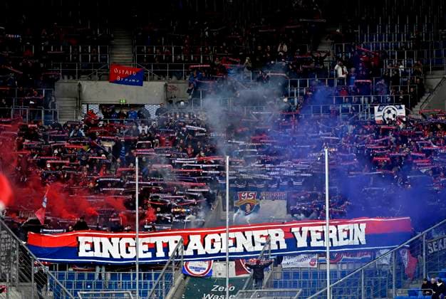 fan block, fans, fan curve, flags, banners, atmosphere, atmospheric bengalos, pyrotechnics, pyro, fireworks, FC Heidenheim ENTERED CLUB TSG 1899 Hoffenheim vs 1 FC Heidenheim 1846 FCH 25 10 2025 DFL REGULATIONS PROHIBIT ANY USE OF PHOTOGRAPHS AS IMAGE SEQUENCES AND OR QUASI VIDEO TSG 1899 Hoffenheim vs 1 FC Heidenheim 1846 FCH