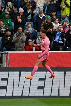GOAL for 1 0 Fisnik Asllani TSG 1899 Hoffenheim 11 goal celebration Pink violet jersey special jersey campaign TOGETHER AGAINST BREAST CANCER TSG 1899 Hoffenheim in the background perimeter advertising logo TSG 1899 Hoffenheim vs 1 FC Heidenheim 1846 FCH 25 10 2025 DFL REGULATIONS PROHIBIT ANY USE OF PHOTOGRAPHS AS IMAGE SEQUENCES AND OR QUASI VIDEO TSG 1899 Hoffenheim vs 1 FC Heidenheim 1846 FCH