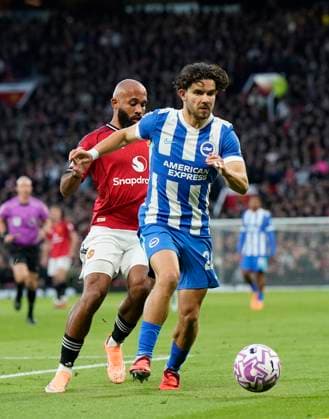 Manchester, England, 25th October 2025. Joel Veltman of Brighton and Matheus Cunha of Manchester United, ManU during the Manchester United vs Brighton and Hove Albion Premier League match at Old Trafford, Manchester. Picture credit should read: Andrew Yates Sportimage EDITORIAL USE ONLY. No use with unauthorised audio, video, data, fixture lists, club league logos or live services. Online in-match use limited to 120 images, no video emulation. No use in betting, games or single club league player publications. SPI_016_AY_Man_Utd_Brighton SPI-4237-0015