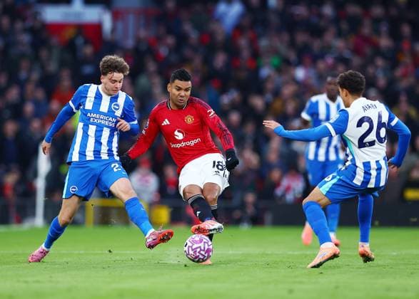 Casemiro of Manchester United, ManU and Maxim De Cuyper of Brighton & Hove Albion Manchester United v Brighton and Hove Albion, Premier League, Football, Old Trafford, Manchester, UK - 25 Oct 2025Manchester Old Trafford United Kingdom EDITORIAL USE ONLY No use with unauthorised audio, video, data, fixture lists, club league logos or live services. Online in-match use limited to 120 images, no video emulation. No use in betting, games or single club league player publications. Copyright: xMattxWest Shutterstockx 15593413j