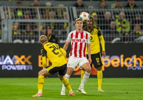 duel between Timo Huebers 1 FC Koeln, 4 and Daniel SVENSSON Borussia Dortmund, 24 25 10 2025, Football, 1 Bundesliga Borussia Dortmund 1 FC Köln in Dortmund, Signal Iduna Park DFL regulations prohibit any use of photographs as image sequences and or quasi video Copyright: HMBxMedia xMarcoxBader