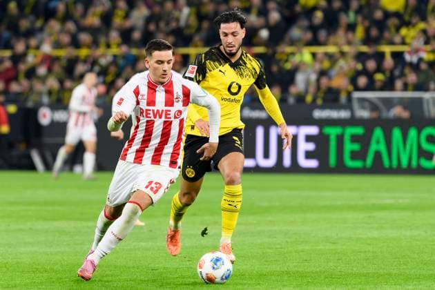 Ramy Bensebaini (Borussia Dortmund) und Said El Mala (1.FC Koeln) im Kampf um den Ball waehrend des spiels der Bundesliga zwischen Borussia Dortmund und 1. FC Köln, Signal Iduna Park am 25. October 2025 in Dortmund, Deutschland. (Foto von Max Maiwald DeFodi Images) +++ Ramy Bensebaini (Borussia Dortmund) und Said El Mala (1.FC Koeln) battle for the ball during the Bundesliga match between Borussia Dortmund and 1. FC Köln at Signal Iduna Park on October 25, 2025 in Dortmund, Germany. (Photo by Max Maiwald DeFodi Images) DFL regulations prohibit any use of photographs as image sequences and or quasi-video. (Photo by Max Maiwald DeFodi Images) Ramy Bensebaini Borussia Dortmund and Said El Mala 1 FC Koeln battle for the ball during the Bundesliga match between Borussia Dortmund and 1 FC Koeln, Signal Iduna Park on October 25, 2025 in Dortmund, Germany Photo by Max Maiwald DeFodi Images Ramy Bensebaini Borussia Dortmund and Said El Mala 1 FC Koeln battle for the ball during the Bundesliga match between Borussia Dortmund and 1 FC Koeln at Signal Iduna Park on October 25, 2025 in Dortmund, Germany Photo by Max Maiwald DeFodi Images DFL regulations prohibit any use of photographs as image sequences and or quasi video Photo by Max Maiwald DeFodi Images