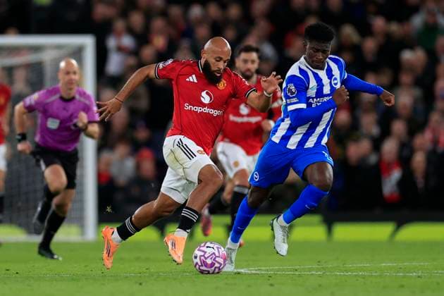 Manchester United, ManU v Brighton and Hove Albion Premier League 25 10 2025. Bryan Mbeumo (19) of Manchester United runs with the ball chased by Carlos Baleba (17) of Brighton & Hove Albion during the Premier League match between Manchester United and Brighton and Hove Albion at Old Trafford, Manchester, England on 25 October 2025. Manchester Old Trafford Greater Manchester England Editorial use only DataCo restrictions apply See www.football-dataco.com , Copyright: xConorxMolloyx PSI-23095-0059