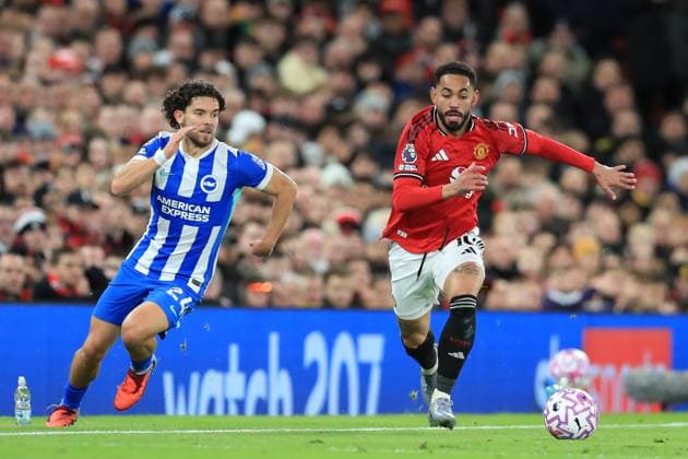 25th October 2025; Old Trafford, Manchester, England; Premier League Football, Manchester United, ManU versus Brighton and Hove Albion; Mats Wieffer of Brighton and Hove Albion takes on Matheus Cunha of Manchester United  DavidxBlunsden
