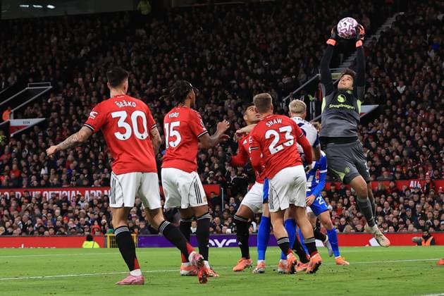 25th October 2025; Old Trafford, Manchester, England; Premier League Football, Manchester United, ManU versus Brighton and Hove Albion; Senne Lammens of Manchester United leaps to claim a cross  DavidxBlunsden