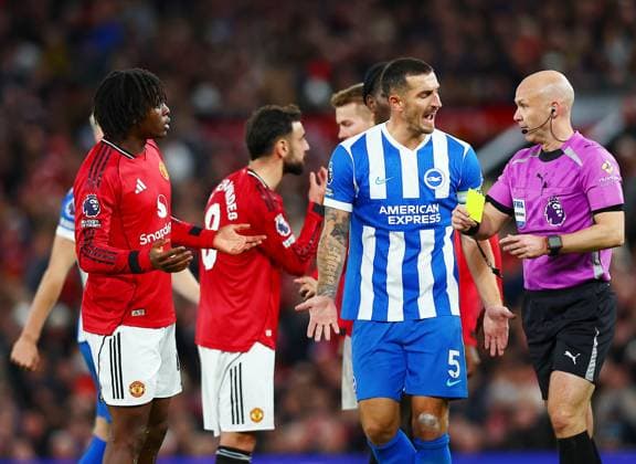Referee Anthony Taylor shows Patrick Dorgu of Manchester United, ManU a yellow card Manchester United v Brighton and Hove Albion, Premier League, Football, Old Trafford, Manchester, UK - 25 Oct 2025Manchester Old Trafford United Kingdom EDITORIAL USE ONLY No use with unauthorised audio, video, data, fixture lists, club league logos or live services. Online in-match use limited to 120 images, no video emulation. No use in betting, games or single club league player publications. Copyright: xMattxWest Shutterstockx 15593413am