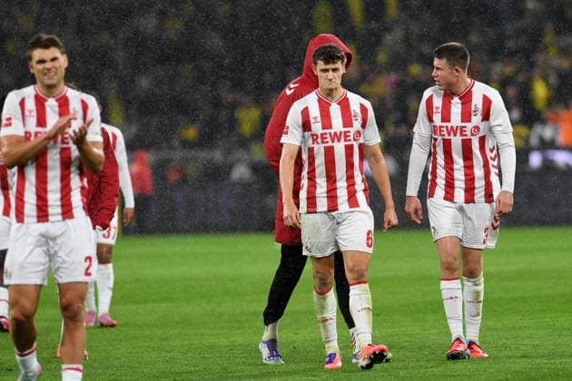 Joel Schmied (1. FC Koeln), Eric Martel (1. FC Koeln) und Dominique Heintz (1. FC Koeln) enttaeuscht waehrend des Spiels der Bundesliga zwischen Borussia Dortmund und 1. FC Köln, Signal Iduna Park am 25. October 2025 in Dortmund, Deutschland. (Foto von Ralf Treese DeFodi Images) +++ Joel Schmied (1. FC Koeln), Eric Martel (1. FC Koeln) und Dominique Heintz (1. FC Koeln) look dejected during the Bundesliga match between Borussia Dortmund and 1. FC Köln at Signal Iduna Park on October 25, 2025 in Dortmund, Germany. (Photo by Ralf Treese DeFodi Images) DFL regulations prohibit any use of photographs as image sequences and or quasi-video. (Photo by Ralf Treese DeFodi Images) Joel Schmied 1 FC Koeln , Eric Martel 1 FC Koeln and Dominique Heintz 1 FC Koeln look dejected during the Bundesliga match between Borussia Dortmund and 1 FC Köln at Signal Iduna Park on October 25, 2025 in Dortmund, Germany Photo by Ralf Treese DeFodi Images Joel Schmied 1 FC Koeln , Eric Martel 1 FC Koeln and Dominique Heintz 1 FC Koeln look dejected during the Bundesliga match between Borussia Dortmund and 1 FC Köln at Signal Iduna Park on October 25, 2025 in Dortmund, Germany Photo by Ralf Treese DeFodi Images DFL regulations prohibit any use of photographs as image sequences and or quasi video Photo by Ralf Treese DeFodi Images