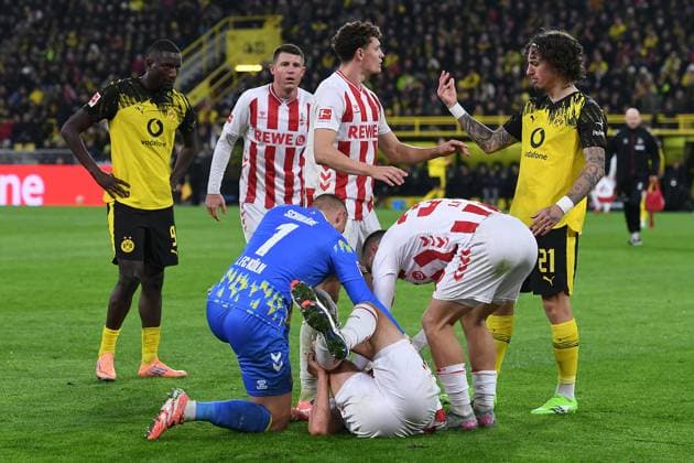 Soccer 1 Bundesliga 8 Matchday Borussia Dortmund 1 FC Köln on 25 10 2025 at Signal Iduna Park in Dortmund Timo Hübers Köln injured on the ground DFL regulations prohibit any use of photographs as image sequences and or quasi video xRx