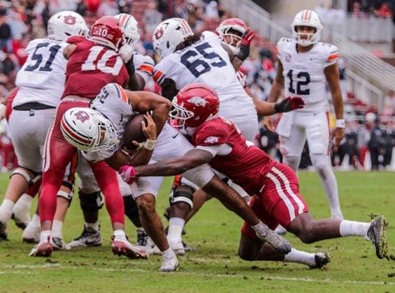 October 25, 2025, Fayetteville, Arkansas, USA: Auburn Tiger running back JEREMIAH COBB (23) fights for yards as he is brought down by Arkansas Razorbacks defensive back LARRY WORTH III (3) during Auburn s win over Arkansas at Donald W. Reynolds Razorback Stadium. Fayetteville USA - ZUMAs199 20251025_znp_s199_046 Copyright: xBrentxSoulex