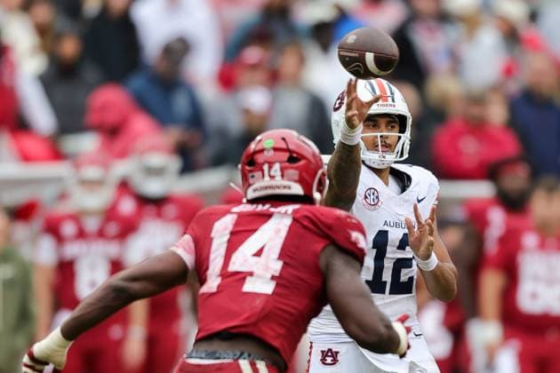 October 25, 2025: Auburn quarterback Ashton Daniels (12) flips the ball off his finger tip out into the flat. Auburn defeated Arkansas 33-24 in Fayetteville, AR. CSM Fayetteville USA - ZUMAcm9_ 20251025_faf_cm9_068 Copyright: xRicheyxMillerx