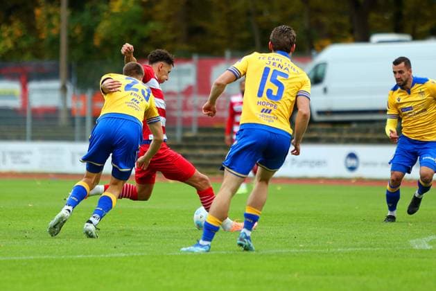 Picture from left Moritz Fritz 23 FC Carl Zeiss Jena vs Soufian Benyamina 90 Greifswalder FC and Marcel Hoppe 15 FC Carl Zeiss Jena Regionalliga Nordost Greifswalder FC red vs FC Carl Zeiss Jena yellow 25 10 2025 in Greifswald