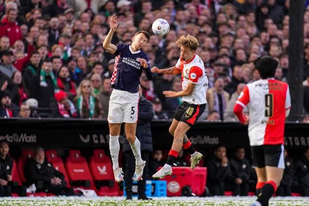 2025-10-26 Feyenoord v PSV - Dutch Eredivisie ROTTERDAM, NETHERLANDS - OCTOBER 26: Ivan Perisic of PSV battles for possession with Luciano Valente of Feyenoord during the Dutch Eredivisie match between Feyenoord and PSV at Stadion Feijenoord on October 26, 2025 in Rotterdam, Netherlands. Rotterdam Stadion Feijenoord Netherlands Content not available for redistribution in The Netherlands directly or indirectly through any third parties. Copyright: xJorisxVerwijstx