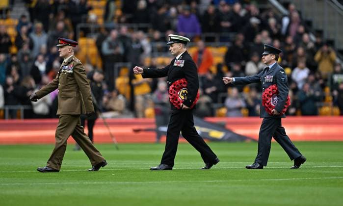 Poppy wreaths are carried onto the pitch by members of the armed forces ahead of Remembrance Day Wolverhampton Wanderers v Burnley, Premier League, Football, Molineux, Wolverhampton, UK - 26 Oct 2025Wolverhampton Molineux United Kingdom EDITORIAL USE ONLY No use with unauthorised audio, video, data, fixture lists, club league logos or live services. Online in-match use limited to 120 images, no video emulation. No use in betting, games or single club league player publications. Copyright: xAnnaxGowthorpe Shutterstockx 15593503q