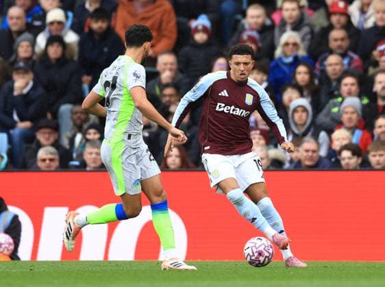Birmingham, England, 26th October 2025. Jadon Sancho of Aston Villa (r) takes on Matheus Nunes of Manchester City (l) during the Aston Villa vs Manchester City Premier League match at Villa Park, Birmingham. Picture credit should read: Jessica Hornby Sportimage EDITORIAL USE ONLY. No use with unauthorised audio, video, data, fixture lists, club league logos or live services. Online in-match use limited to 120 images, no video emulation. No use in betting, games or single club league player publications. SPI_028_JH_Villa_City SPI-4240-0028