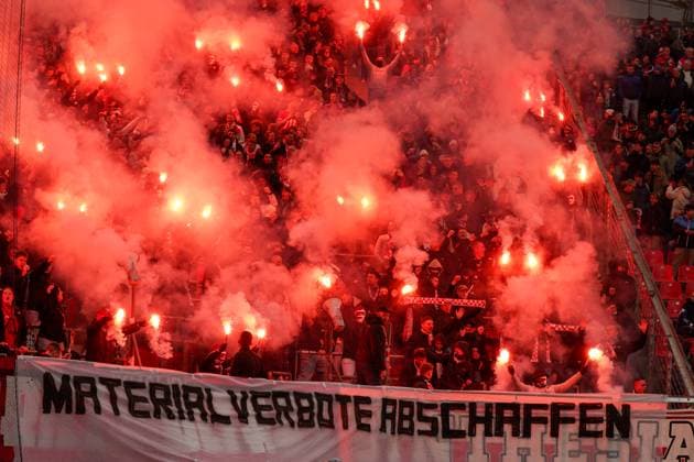 Germany, Leverkusen, Europe Guest fans of SC Freiburg with pyrotechnics and banner abolish material bans in the away block of the BayArena at the Bundesliga match against Bayer 04 Leverkusen, 8 matchday 2025 26 fans, protest, atmosphere, security, pyrotechnics, Bundesliga, football Leverkusen North Rhine-Westphalia Germany Copyright: xJOERANxSTEINSIEKx