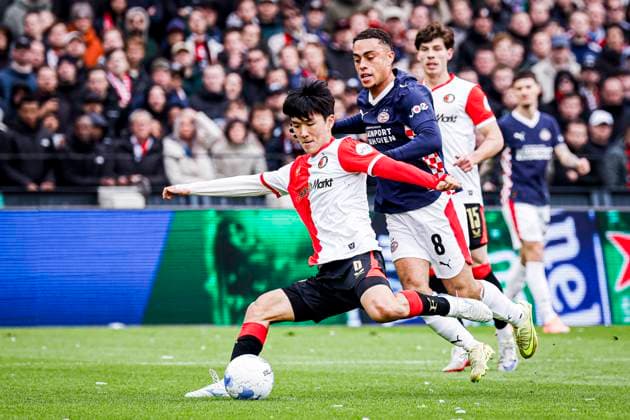 Inbeom Hwang of Feyenoord Rotterdam battles for possession with Sergino Dest of PSV Eindhoven Feyenoord Rotterdam v PSV Eindhoven, Eredivisie, Feyenoord Rotterdam v PSV Eindhoven, De Kuip, October 26, 2025, Rotterdam, Netherlands.