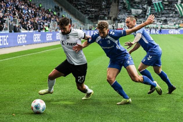 Malik Batmaz Preussen Münster,23 vs Alexander Nollenberger 1 FC Magdeburg,17 and Baris Atik 1 FC Magdeburg,23 2 Soccer Bundesliga Season 2025 2026 1 FC Magdeburg vs Preussen Münster at the Avnet Arena in Magdeburg Action,Soccer,Man,Men,Germany,26 10 2025