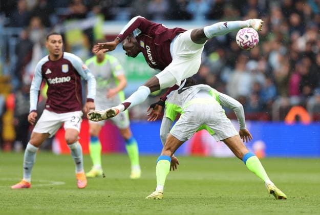 Amadou Onana of Aston Villa is sent flying in a challenge with Tijjani Reijnders of Manchester City Aston Villa v Manchester City, Premier League, Football, Villa Park, Birmingham, UK - 26 Oct 2025Birmingham Villa Park United Kingdom EDITORIAL USE ONLY No use with unauthorised audio, video, data, fixture lists, club league logos or live services. Online in-match use limited to 120 images, no video emulation. No use in betting, games or single club league player publications. Copyright: xKieranxMcManus Shutterstockx 15593465ab