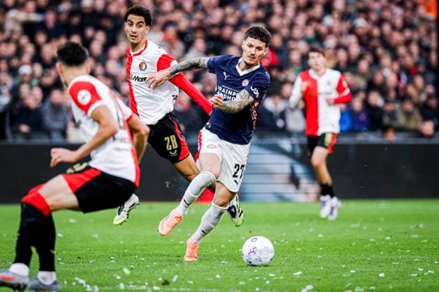 Dennis Man of PSV Eindhoven battles for possession with Oussama Targhalline of Feyenoord Rotterdam Feyenoord Rotterdam v PSV Eindhoven, Eredivisie, Feyenoord Rotterdam v PSV Eindhoven, De Kuip, October 26, 2025, Rotterdam, Netherlands.