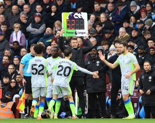 Birmingham, England, 26th October 2025. Oscar Bobb of Manchester City and Bernardo Silva of Manchester City are substituted during the Aston Villa vs Manchester City Premier League match at Villa Park, Birmingham. Picture credit should read: Jessica Hornby Sportimage EDITORIAL USE ONLY. No use with unauthorised audio, video, data, fixture lists, club league logos or live services. Online in-match use limited to 120 images, no video emulation. No use in betting, games or single club league player publications. SPI_046_JH_Villa_City SPI-4240-0046