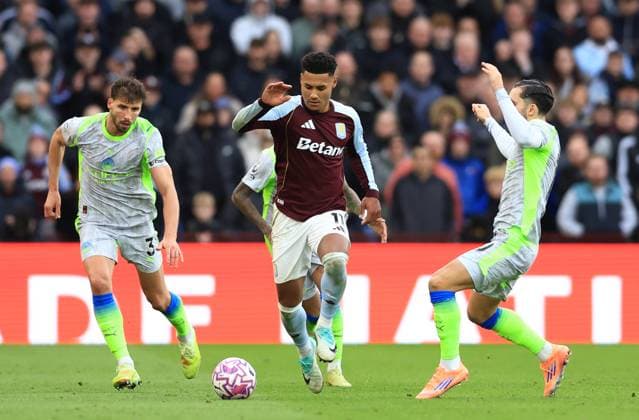 Birmingham, England, 26th October 2025. Ollie Watkins of Aston Villa (c) challenged by Rayan Cherki of Manchester City (r) during the Aston Villa vs Manchester City Premier League match at Villa Park, Birmingham. Picture credit should read: Jessica Hornby Sportimage EDITORIAL USE ONLY. No use with unauthorised audio, video, data, fixture lists, club league logos or live services. Online in-match use limited to 120 images, no video emulation. No use in betting, games or single club league player publications. SPI_050_JH_Villa_City SPI-4240-0050