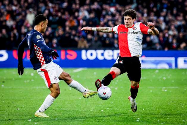Jordan Bos of Feyenoord Rotterdam battles for possession with Sergino Dest of PSV Eindhoven Feyenoord Rotterdam v PSV Eindhoven, Eredivisie, Feyenoord Rotterdam v PSV Eindhoven, De Kuip, October 26, 2025, Rotterdam, Netherlands.