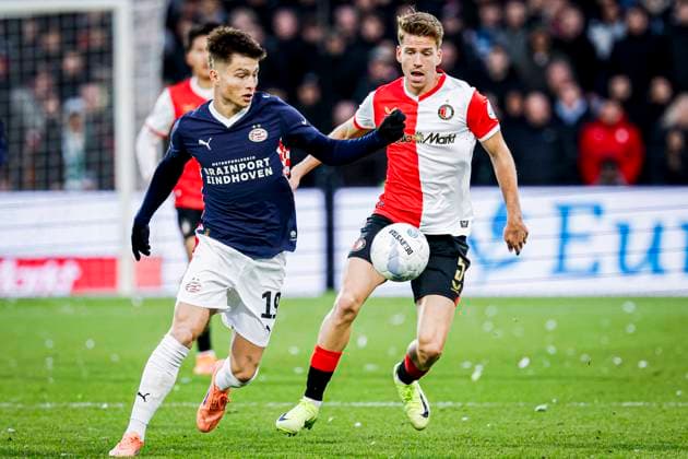 Esmir Bajraktarevic of PSV Eindhoven battles for possession with Gijs Smal of Feyenoord Rotterdam Feyenoord Rotterdam v PSV Eindhoven, Eredivisie, Feyenoord Rotterdam v PSV Eindhoven, De Kuip, October 26, 2025, Rotterdam, Netherlands.