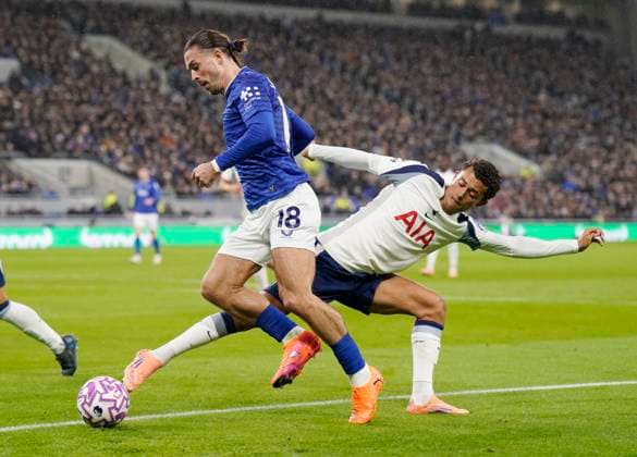 Liverpool, England, 26th October 2025. Brennan Johnson of Tottenham tracks Jack Grealish of Everton during the Everton vs Tottenham Hotspur Premier League match at Hill Dickinson Stadium, Liverpool. Picture credit should read: Andrew Yates Sportimage EDITORIAL USE ONLY. No use with unauthorised audio, video, data, fixture lists, club league logos or live services. Online in-match use limited to 120 images, no video emulation. No use in betting, games or single club league player publications. SPI_016_AY_Everton_Spurs SPI-4241-0016