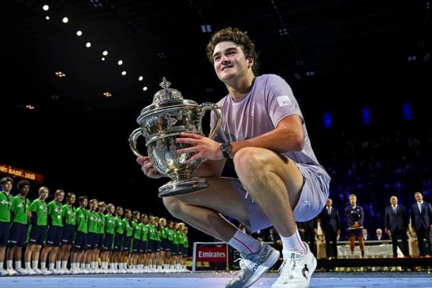 26th October 2025; St. Jakobshalle, Basel, Switzerland; 2025 ATP, Tennis Herren Swiss Indoor Tennis Final Day; Joao Fonseca (BRA) lifts the trophy after winning the match against Alejandro Davidovich Fokina (ESP) in the final  DavidxEmm