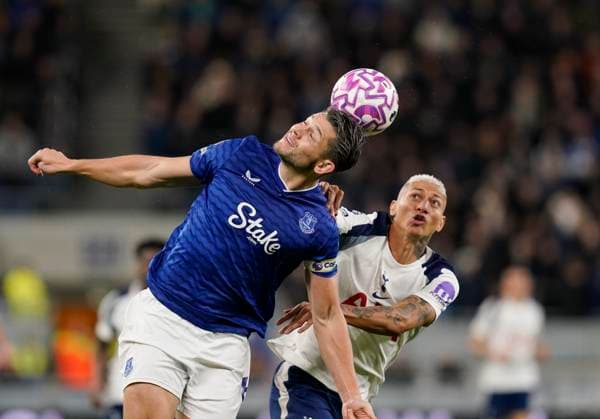 Liverpool, England, 26th October 2025. James Tarkowski of Everton tussles with Richarlison of Tottenham during the Everton vs Tottenham Hotspur Premier League match at Hill Dickinson Stadium, Liverpool. Picture credit should read: Andrew Yates Sportimage EDITORIAL USE ONLY. No use with unauthorised audio, video, data, fixture lists, club league logos or live services. Online in-match use limited to 120 images, no video emulation. No use in betting, games or single club league player publications. SPI_051_AY_Everton_Spurs SPI-4241-0051