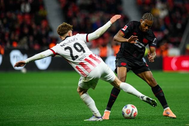 LEVERKUSEN, GERMANY - 26 OCTOBER, 2025: Jeanuel Belocian, Philipp Treu - The match of Bundesliga Bayer 04 Leverkusen vs SC Freiburg at BayArena.  Copyright: xVitaliixKliuievx