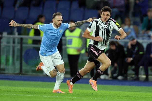 Football: Serie A Enilive 2025-2026 matchday, SS Lazio vs Juventus FC Turin Rome, Italy October 26, 2025: Manuel Lazzari of Lazio, Andrea Cambiaso of Juventus F.C. seen in action during the Serie A Enilive 2025-2026 football match day 8, between SS Lazio vs Juventus FC Turin at Olympic Stadium. rome olympic stadium italy italy Copyright: xmarcoxiacobucci