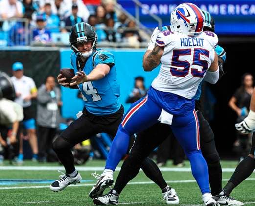 October 26, 2025: Carolina quarterback Andy Dalton (14) scrambles away from Buffalo linebacker Mike Hoecht (55). NFL, American Football Herren, USA football game between Buffalo Bills and Carolina Panthers at Bank of America Stadium, Charlotte , North Carolina. CSM Charlotte United States of America - ZUMAc04_ 20251026_zma_c04_069 Copyright: xDavidxBeachx