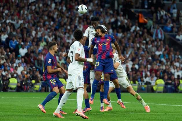 Aurelien Tchouameni of Real Madrid CF battles for the ball with Jules Kounde of FC Barcelona, Barca during the LALIGA EA SPORTS match between Real Madrid CF and FC Barcelona at the Santiago Bernabeu Stadium, on 26 October 2025. - 26 10 2025 - Spain Madrid Madrid -  LGMx xLexPictorium LePictorium_0318026