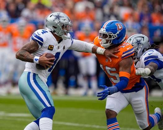 October 26, 2025: Dallas Cowboys quarterback Dak Prescott (4) fends off Denver Broncos linebacker Nik Bonitto (15) before being sacked in the first half of the football game between the Denver Broncos and Dallas Cowboys. CSM. - ZUMAc04_ 20251026_zma_c04_220 Copyright: xDerekxRegensburgerx