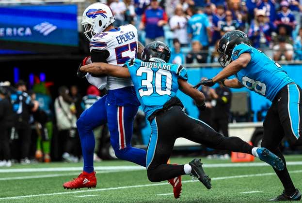 October 26, 2025: Carolina running back Chuba Hubbard (30) brings down Buffalo defensive end A.J. Epenesa (57) after interception. NFL, American Football Herren, USA football game between Buffalo Bills and Carolina Panthers at Bank of America Stadium, Charlotte , North Carolina. CSM Charlotte United States of America - ZUMAc04_ 20251026_zma_c04_315 Copyright: xDavidxBeachx