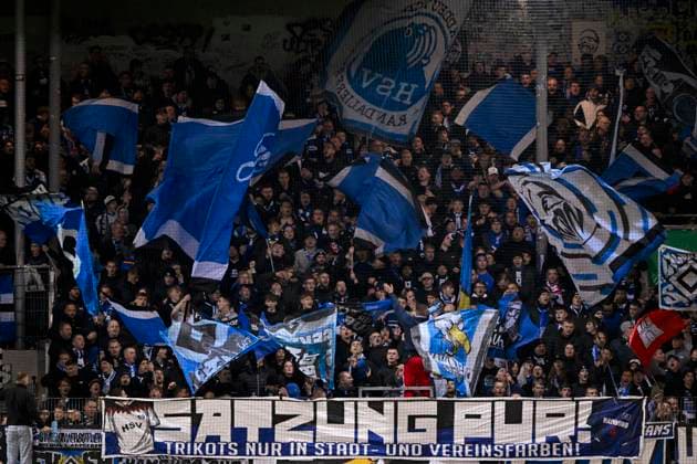 Fan block, fans, fan curve, flags, flags, mood, atmospheric Hamburger SV HSV banner, protest, protest poster, fan poster, banner, poster, banner SATZUNG PUR TRIKOTS NUR IN STADT UND VEREINSFARBEN 1 FC Heidenheim 1846 FCH vs Hamburger SV HSV DFB Pokal Zweite Runde 28 10 2025 DFL REGULATIONS PROHIBIT ANY USE OF PHOTOGRAPHS AS IMAGE SEQUENCES AND OR QUASI VIDEO 1 FC Heidenheim 1846 FCH vs Hamburger SV HSV