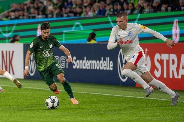 Germany, Football, DFB Cup, 2nd round, 2025 2026, VfL Wolfsburg Holstein Kiel on 28 10 in Wolfsburg Volkswagen Arena Mohammed Amoura VfL Wolfsburg 9 in duel with David Zec Holstein Kiel 26 Copyright: xSvenxHeidmannx