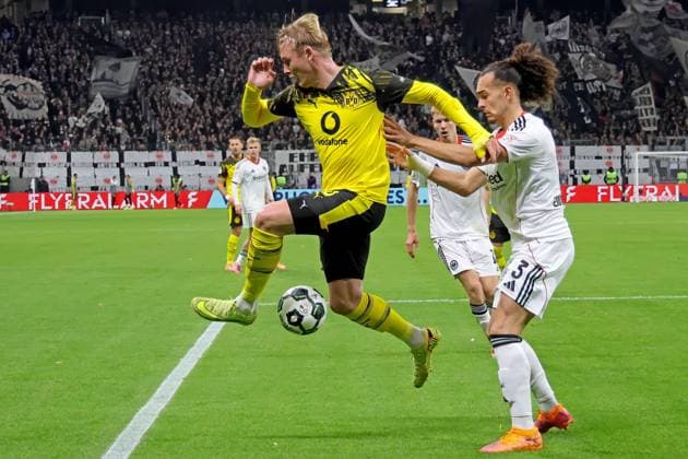 Frankfurt, Germany 28 October 2025 DFB Pokal 2025 2026 Eintracht Frankfurt vs Borussia Dortmund In the picture v li in the duel Julian Brandt Dortmund against Arthur Theate Frankfurt DFB regulations prohibit any use of photographs as image sequences and or quasi video Deutsche Bank Park Hessen Copyright: xFotostandx xRacochax