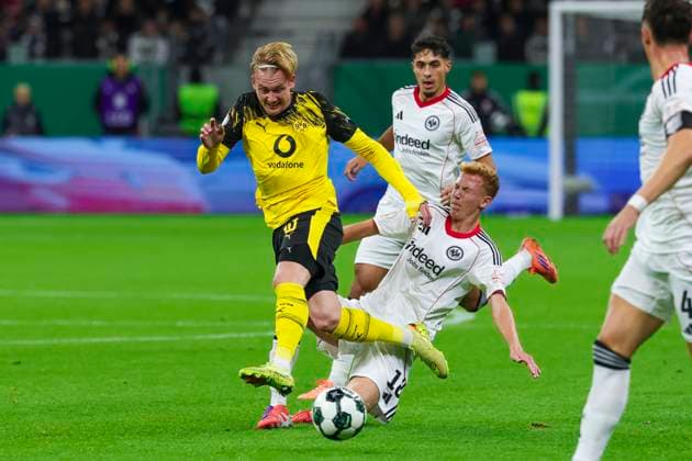 DFB Cup Eintracht Frankfurt v Borussia Dortmund Julian Brandt (Borussia Dortmund) battle for the ball against Hugo Larsson of Eintracht Frankfurt during the DFB Cup Second Round match between Eintracht Frankfurt and Borussia Dortmund at Deutsche Bank Park in Frankfurt, Germany, on October 28, 2025. (Photo by Kadir Caliskan Middle East Images) Frankfurt Hessen Germany Copyright: xKadirxCaliskanx